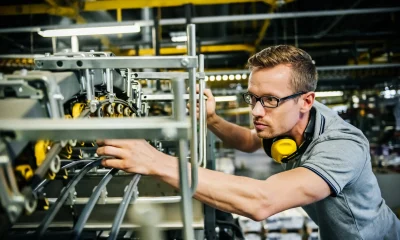 Engineer checking machine parts of a heavy machine