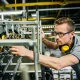 Engineer checking machine parts of a heavy machine