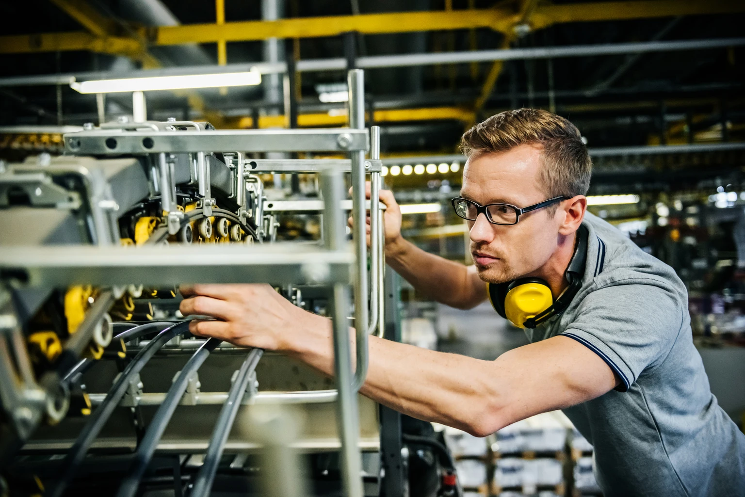 Engineer checking machine parts of a heavy machine