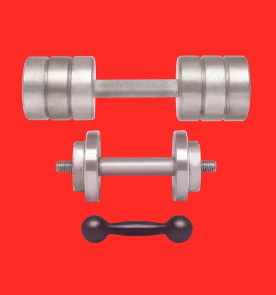 Sports equipment - different weight dumbbells isolated on red background