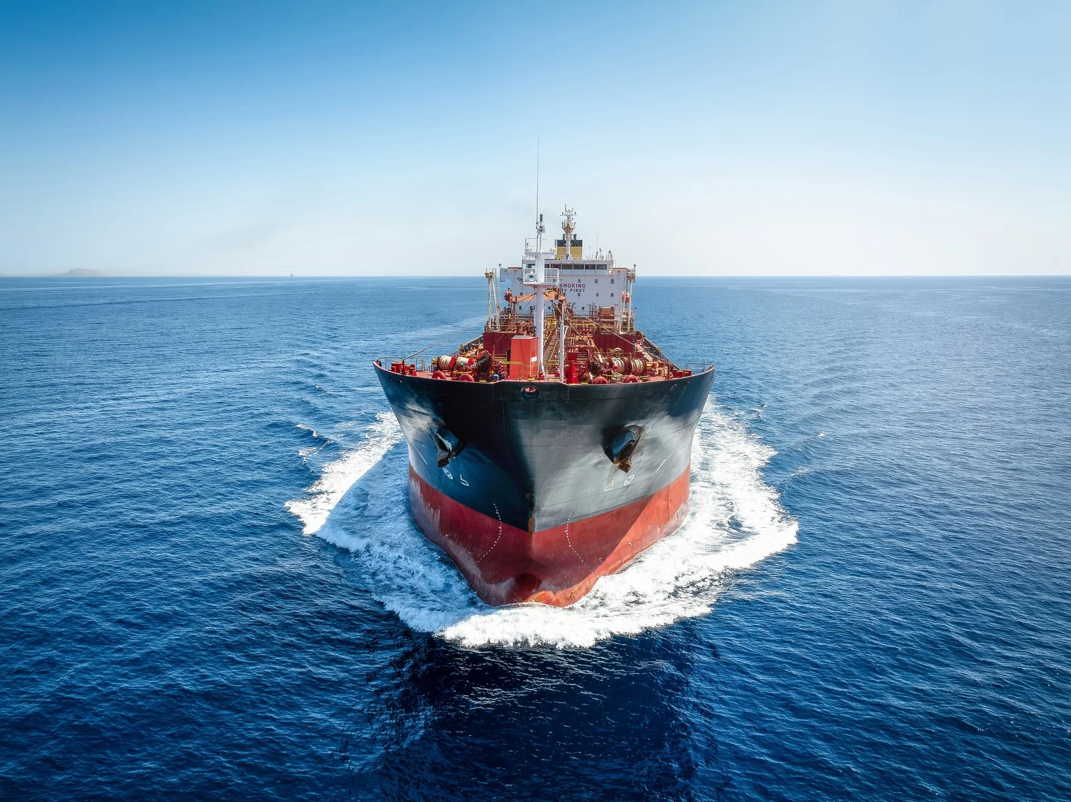 Front view of a chemical goods or oil tanker in motion