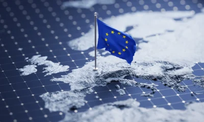 Flag of European Union waving on pole on the 3d topographic map surface and abstract background with a grid
