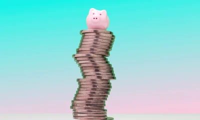 Savings concept - Piggy bank on US nickel coins
