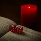 mystical scene with dice, book and candle