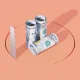 Rolled American One Hundred Dollars Bills And Handsaw On Orange Background