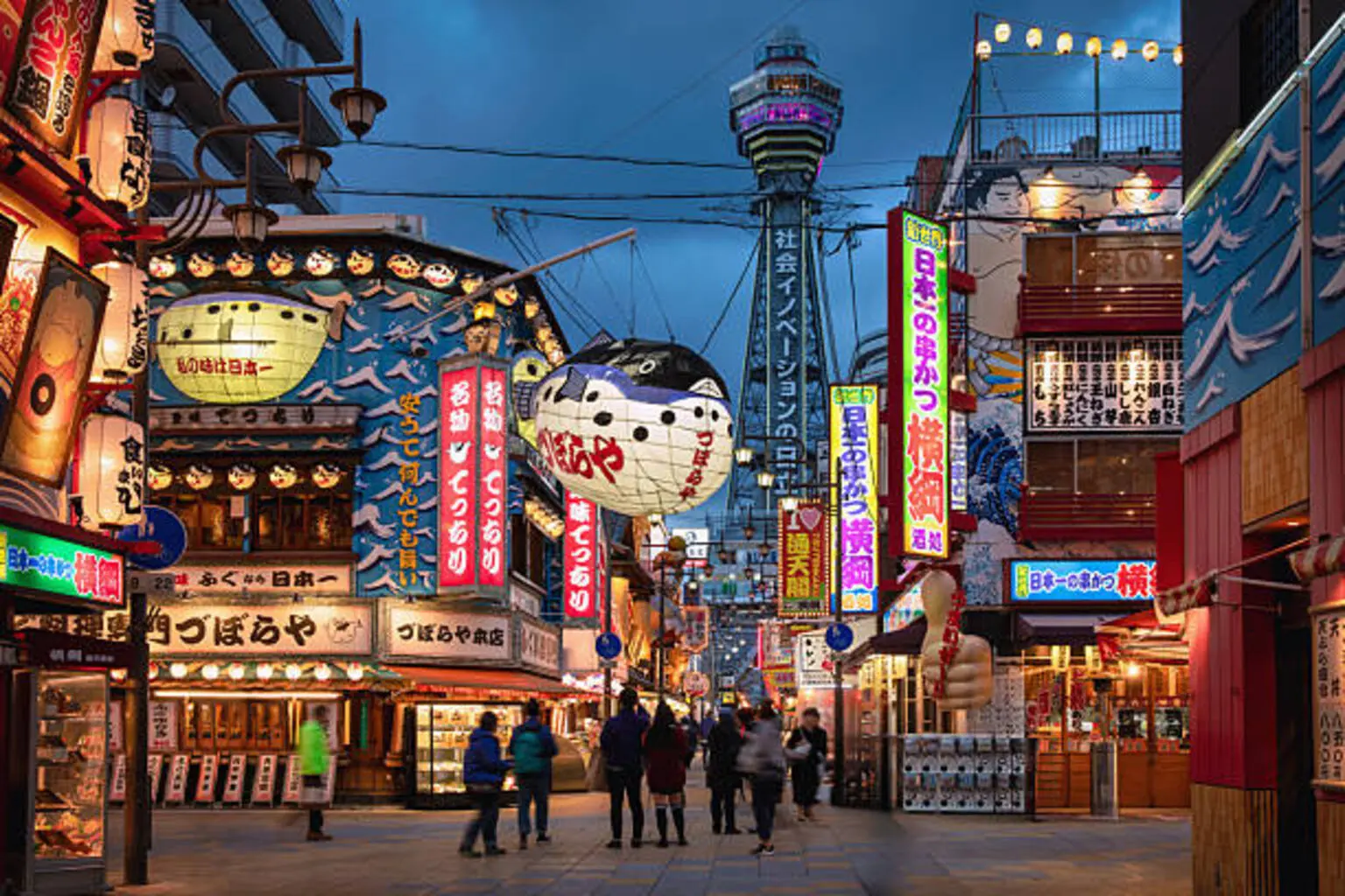 Osaka Twilight People Walking in Shinsekai Tsutenkaku Tower in the Background Japan