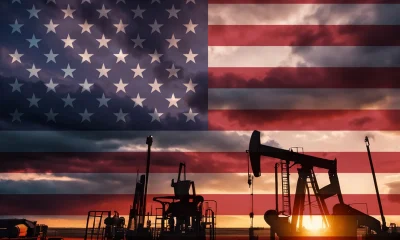 Drilling for oil in the countryside with American national flag overlay