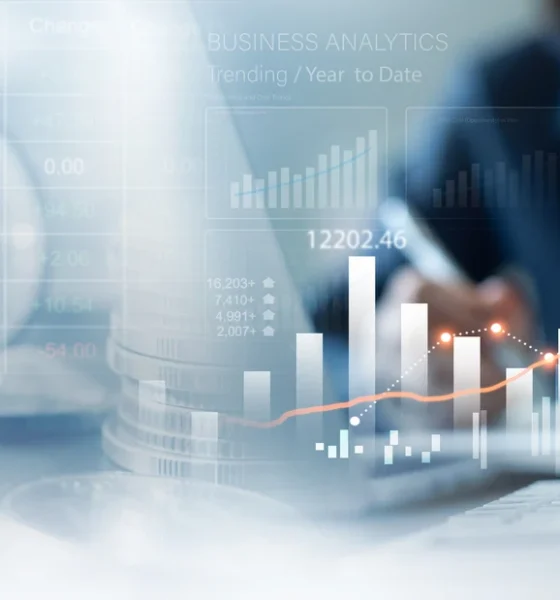 Business, finance and investment concept. Business woman analyzing and calculating financial data with economic graph growth chart, Business strategy and planning. digital market research, financial report