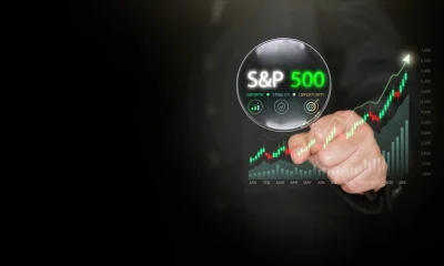 S and P 500 stock market growth shown through magnifying glass and rising growing chart on dark copy space. Financial analysis, investment strategy, trading dashboard, market trend visualization.