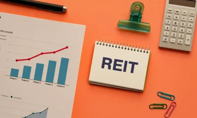 REIT Real Estate Investment Trust Concept with Financial Charts