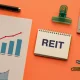 REIT Real Estate Investment Trust Concept with Financial Charts