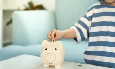 Save money. children putting coin for saving. wealth, Finance, insurance, investment, education, future, plan life, learn, banking, family, health, health and accident insurance.