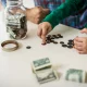 Father and son counting money at home