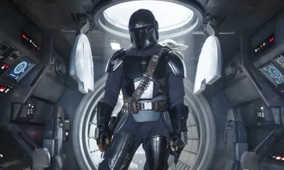 Pedro Pascal and Grogu in Star Wars: The Mandalorian and Grogu