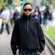 MILAN, ITALY - SEPTEMBER 20: Yuwei Zhangzou wears black zipper, skirt, burgundy bag outside Gucci during the Milan Fashion Week Menswear Spring/Summer 2025 on September 20, 2024 in Milan, Italy. (Photo by Christian Vierig/Getty Images)