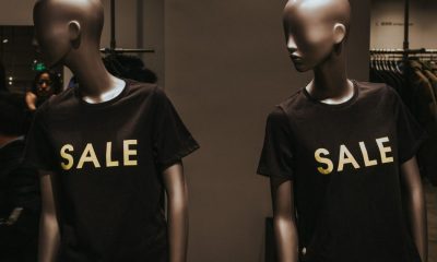 store mannequins wear t-shirts that say SALE