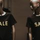 store mannequins wear t-shirts that say SALE