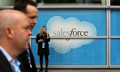 Salesforce has bought word processing startup Quip for $582 million. Here, a woman stands near a Salesforce sign during the company's annual Dreamforce event, in San Francisco, Nov. 18, 2013.