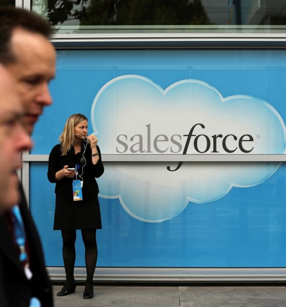 Salesforce has bought word processing startup Quip for $582 million. Here, a woman stands near a Salesforce sign during the company's annual Dreamforce event, in San Francisco, Nov. 18, 2013.