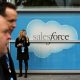 Salesforce has bought word processing startup Quip for $582 million. Here, a woman stands near a Salesforce sign during the company's annual Dreamforce event, in San Francisco, Nov. 18, 2013.