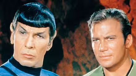 Leonard Nimoy and William Shatner looking intrigued in Star Trek: The Original Series