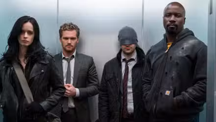 Jessica Jones, Danny Rand, Matt Muedock, and Luke Cage in an elevator in The Defenders.