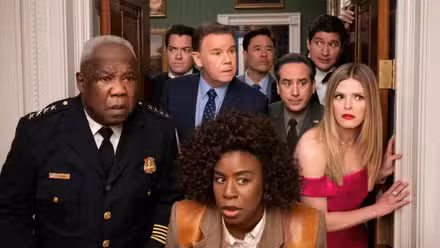 Uzo Aduba, Isiah Whitlock Jr., Dan Marino, Randall Park, and other cast of The Residence in a doorway.