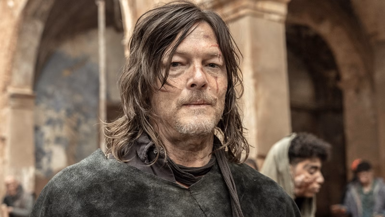 Norman Reedus as Daryl in close-up and looking at the camera in The Walking Dead: Daryl Dixon Season 3