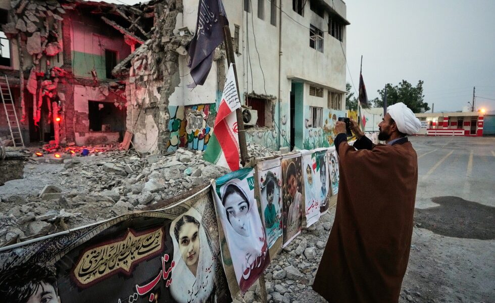 Iranian families grieve at a school where a US strike killed dozens
