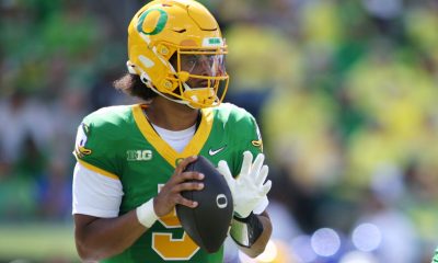 Moore throws for 3 TDs and No. 2 Oregon overcomes a slow start to beat Boise State 34-27