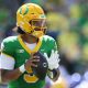 Moore throws for 3 TDs and No. 2 Oregon overcomes a slow start to beat Boise State 34-27
