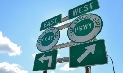 Signs mark the entrance to the Lake Ontario State Parkway on Aug. 25, 2026, in Rochester, N.Y.