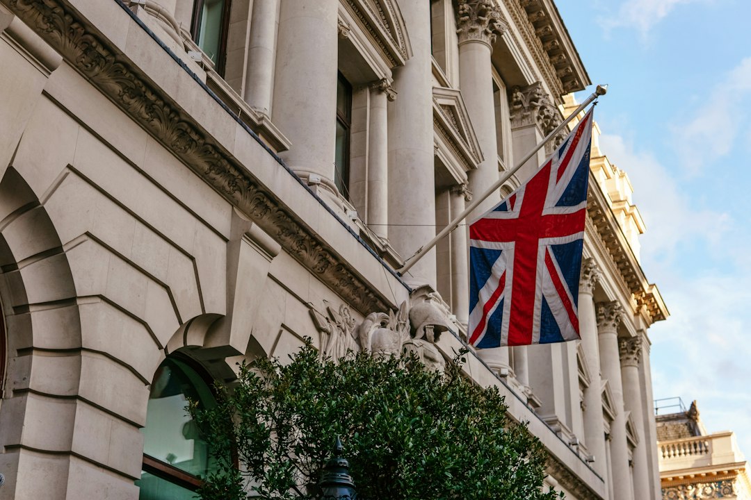 UK flag on a government building, symbolising regulatory authority and oversight