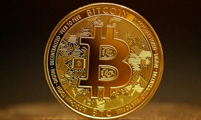 A shiny gold Bitcoin coin with the distinctive Bitcoin symbol, representing the seized cryptocurrency at the centre of the legal battle