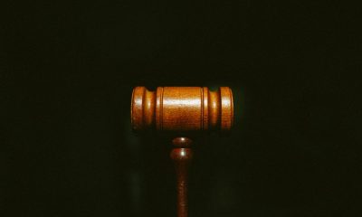 Wooden gavel on dark background representing UK court decision