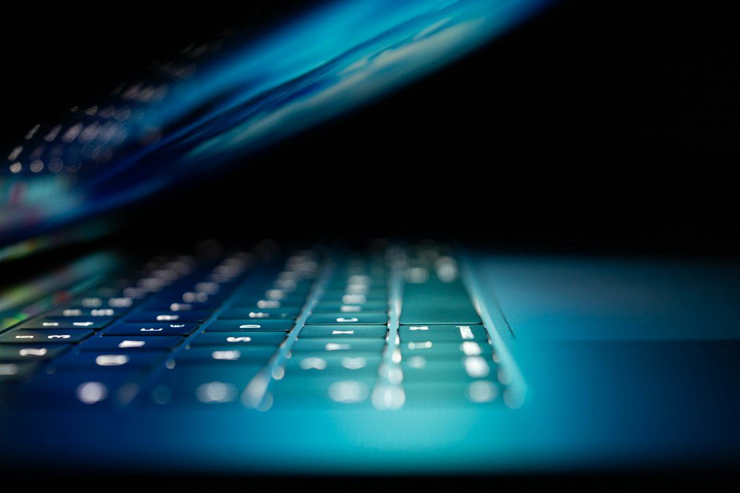 Close-up of laptop computer showing digital network data
