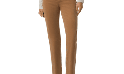 woman wears brownish straight-leg cords with sneaks