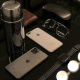 Two iPhones with duo cases next to a coffee